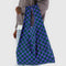 model holding green and dark blue checkered big baggu