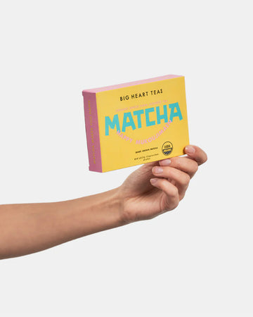 model holding box of 10 matcha sticks