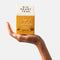 model holding set of 10 golden tumeric and ginger tea bags