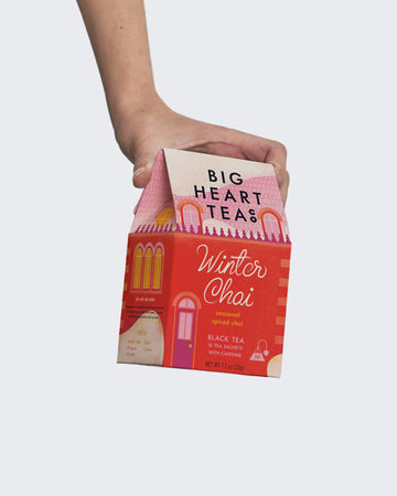 model holding box of 10 winter chai tea bags