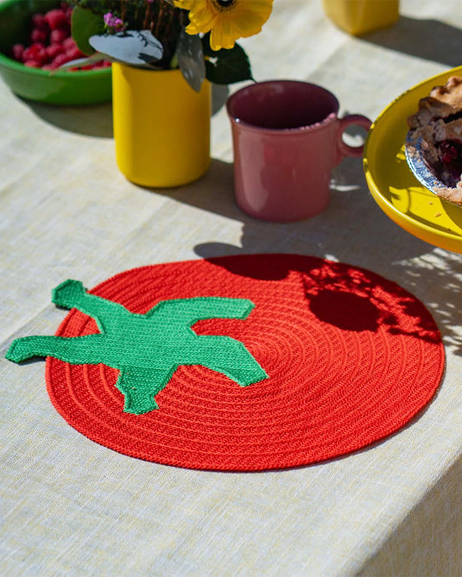 tomato shaped placemat on a table