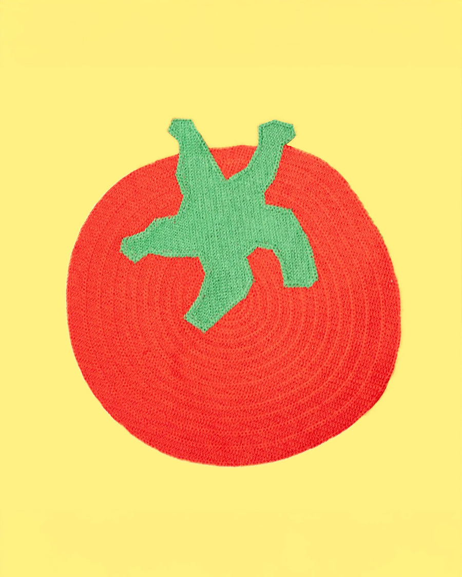 tomato shaped placemat on a yellow ground