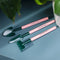 set of 3 pink mini houseplant tools set on a table