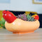 bottom view of hot dog shaped planter filled with three succulents