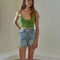 model wearing green crochet cropped tank