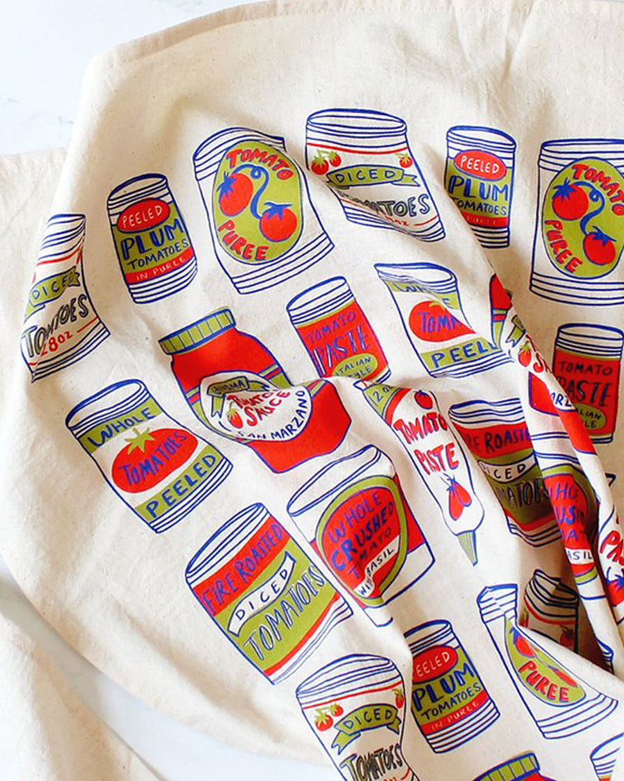 up close of colorful canned tomatoes tea towel