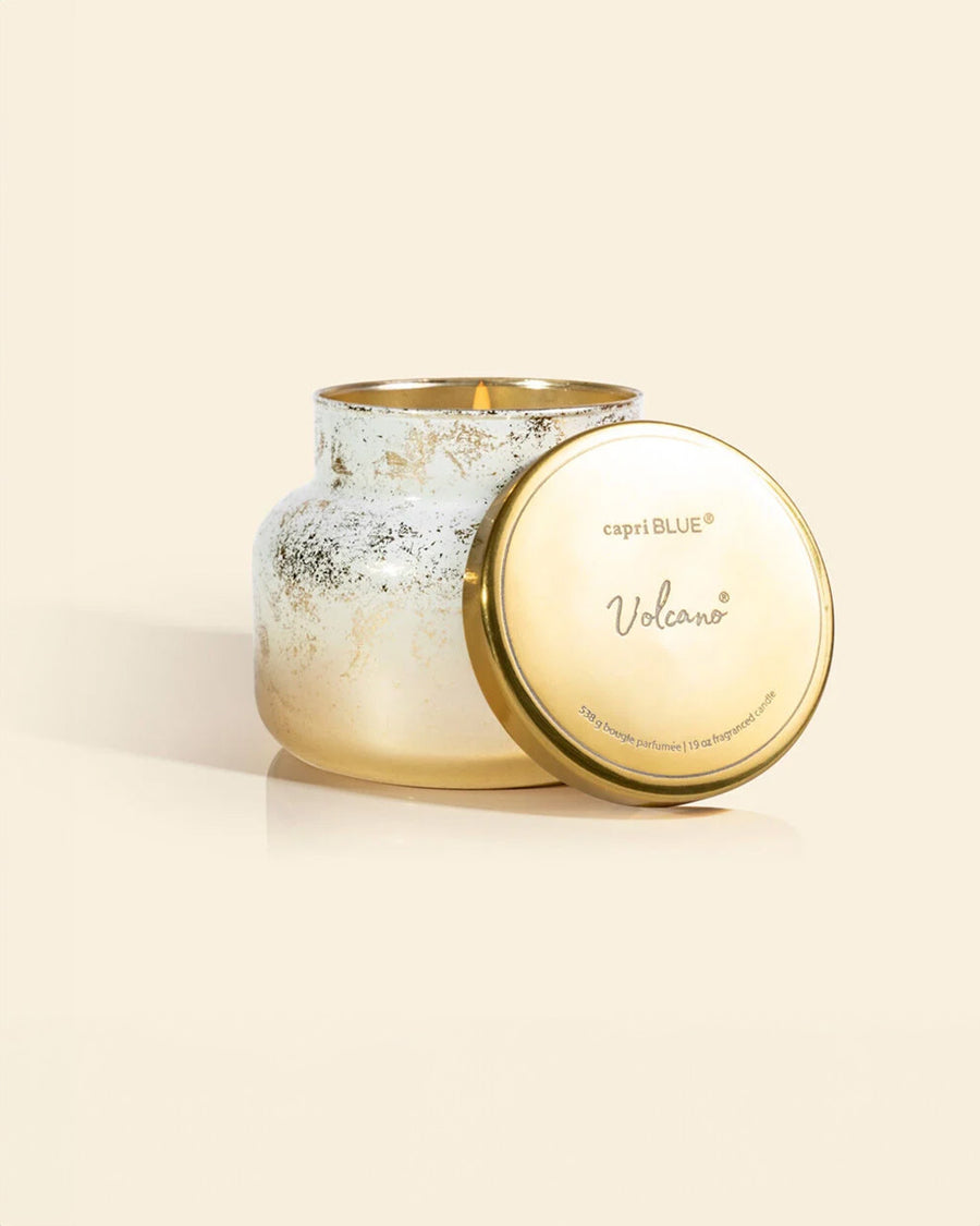 gold and white glimmer candle with gold lid