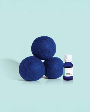 set of three blue dryer balls with volcano essential oil