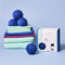 set of three blue dryer balls on a pile of towels