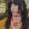 model wearing pink and white stripe bandana with orange print