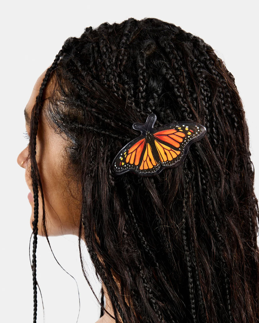 model wearing realistic monarch butterfly hair barrette