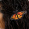 up close of model wearing realistic monarch butterfly hair barrette