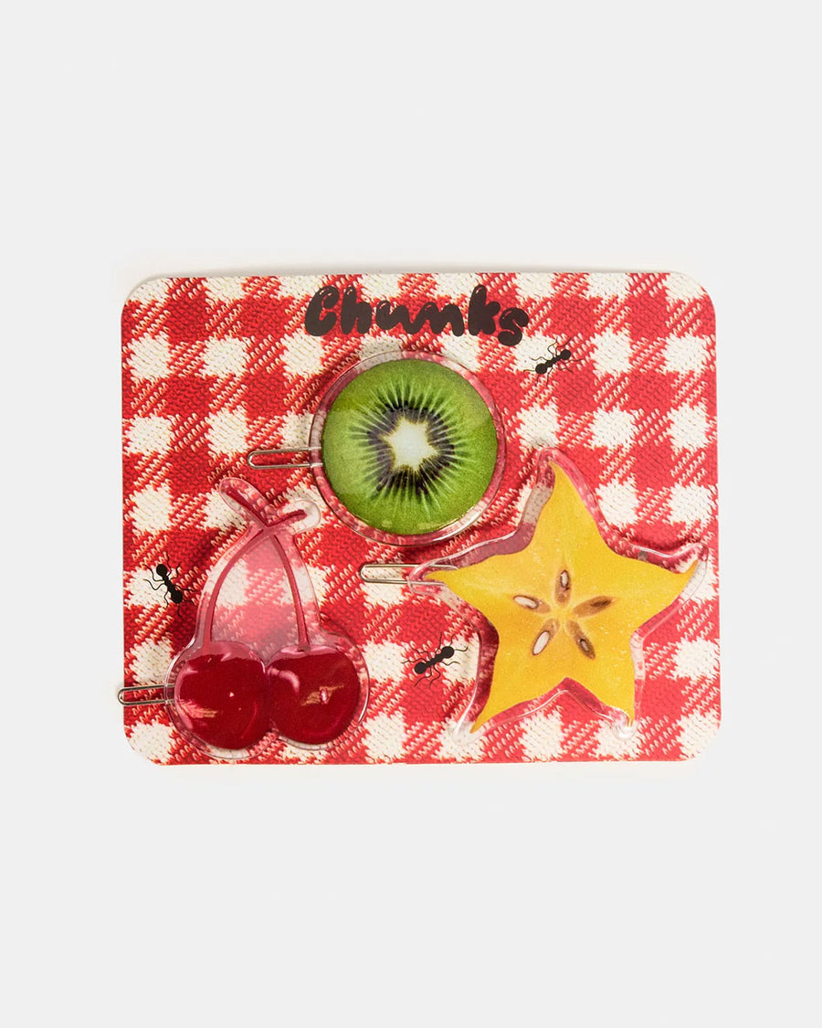 packaged set of three realistic fruit print clips: yellow starfruit, kiwi, and cherries