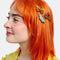 model wearing set of three realistic moth print hair clips