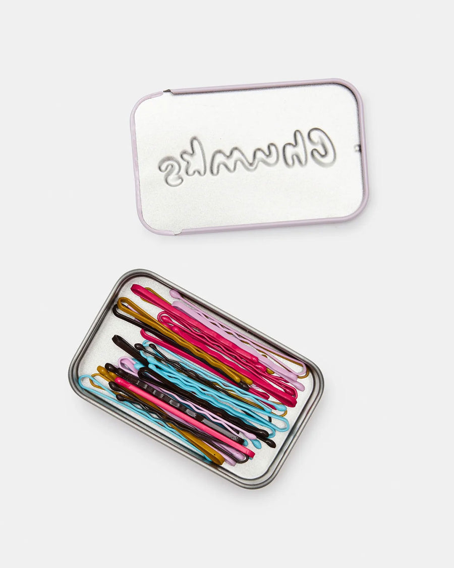 lid off of lilac butterfly printed tin of colorful bobby pins