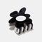 black and white flower shaped hair claw