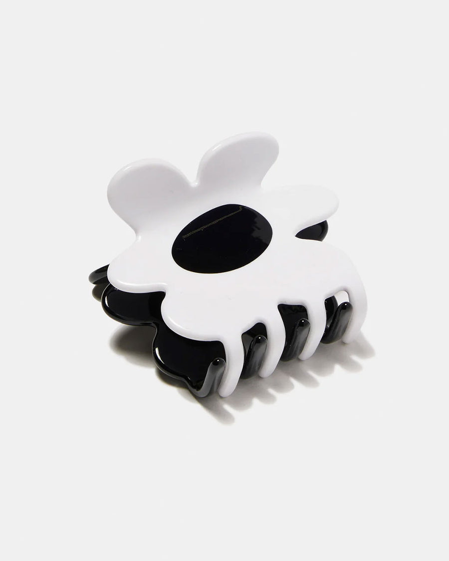 reversed side of black and white flower shaped hair claw