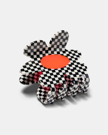 black and white checkered flower hair claw with orange center