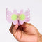 model opening shimmer lilac flower hair claw with yellow/lime center