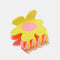 reversed side of pink and yellow flower shaped hair claw