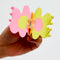 model opening pink and yellow flower shaped hair claw