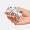 model holding white small hair claw with blue, pink and black terrazzo print