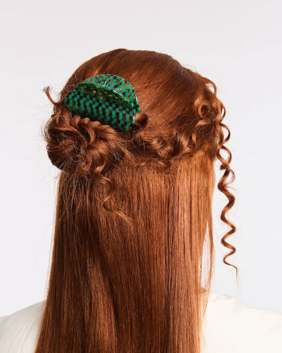 model wearing emerald green and turquoise checkered hair claw