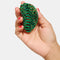 model holding emerald green and turquoise checkered hair claw