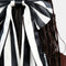 up close of model wearing black and white stripes oversized hair bow clip