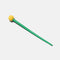 green hair stick with yellow ball on the end