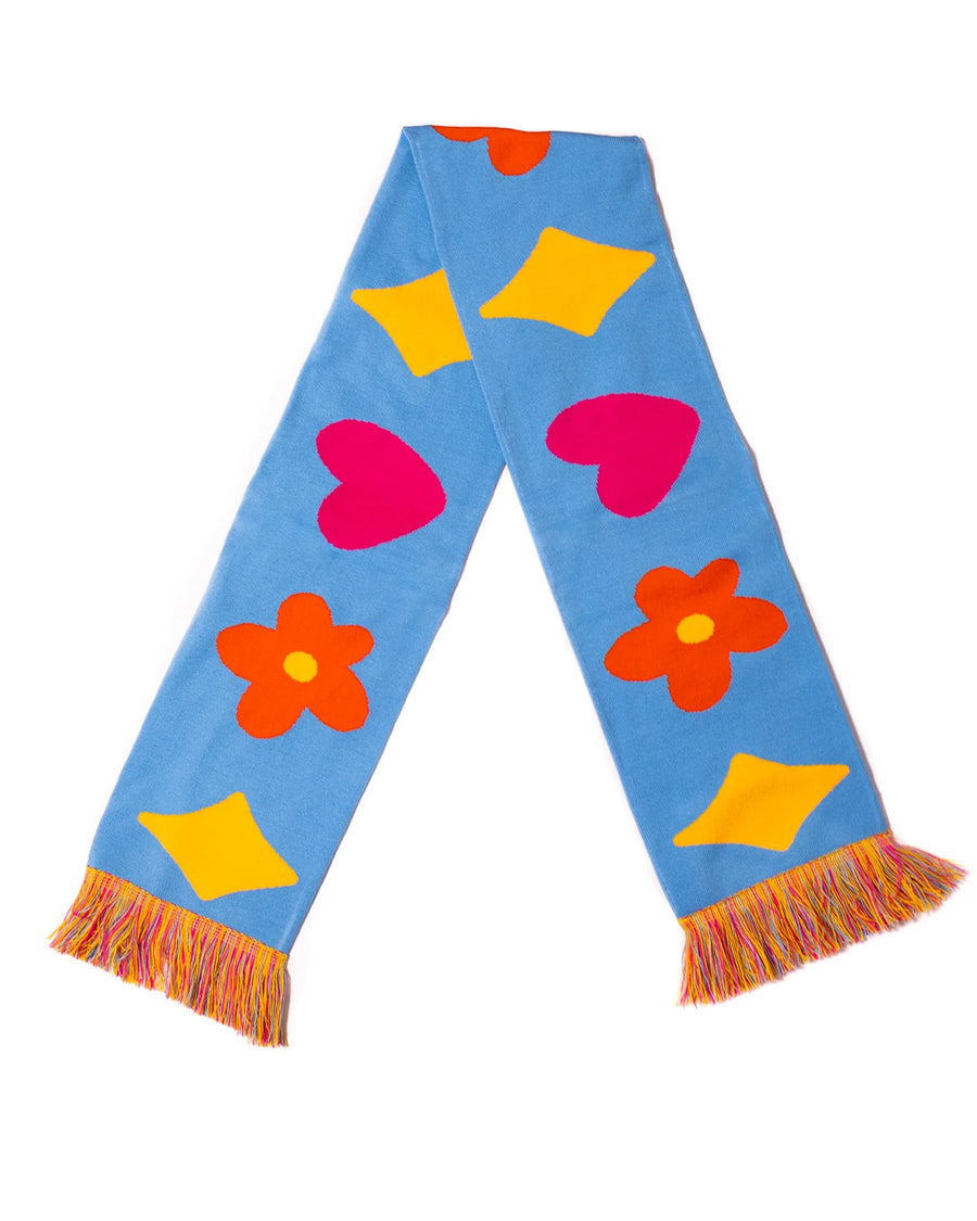 blue rectangle scarf with colorful tassels on the end and yellow diamond, orange flower and pink heart design