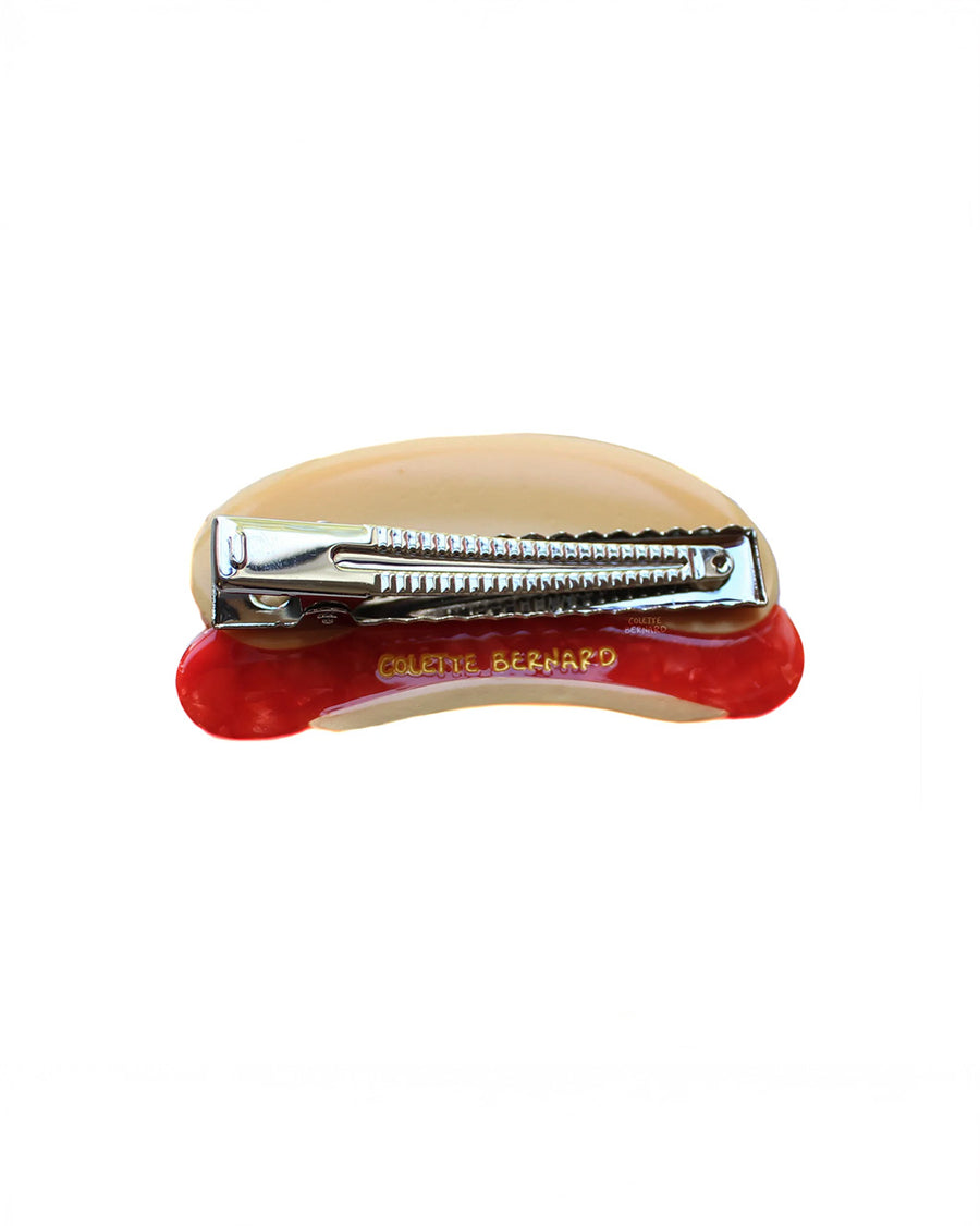 back view of hot dog hair clip with 'new york' written in mustard
