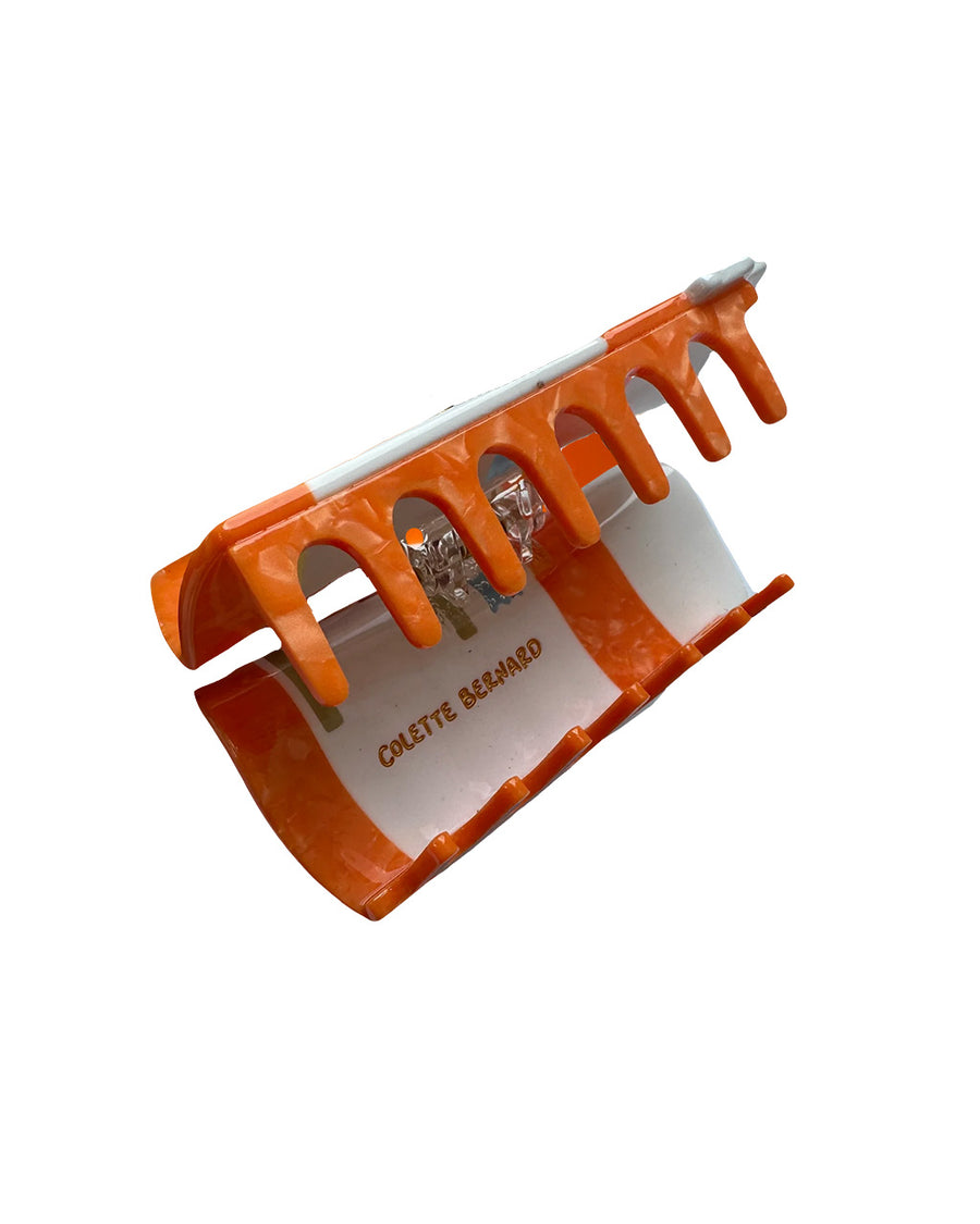 acrylic claws on orange prescription bottle hair claw