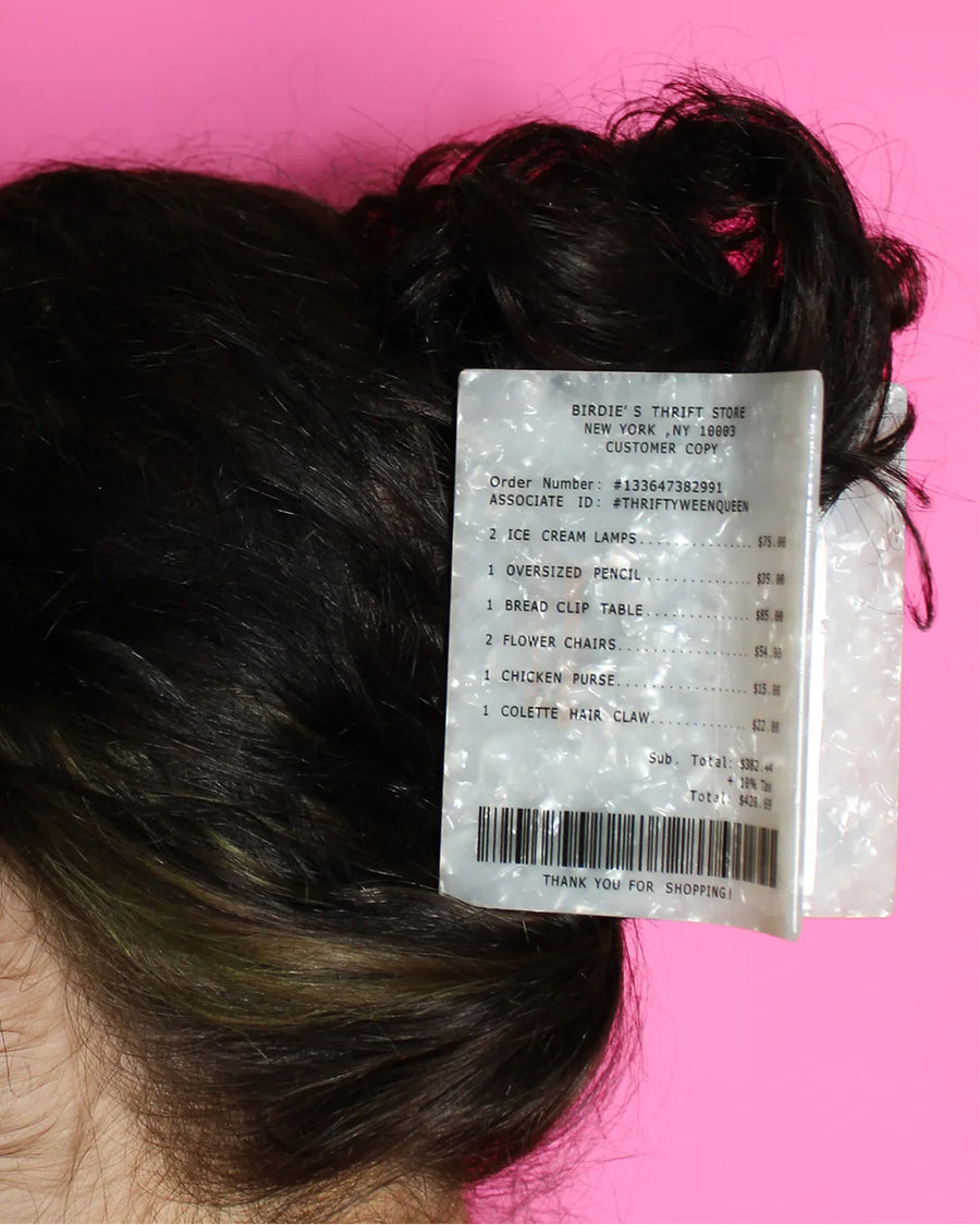 model wearing birdie wood collab store receipt hair claw