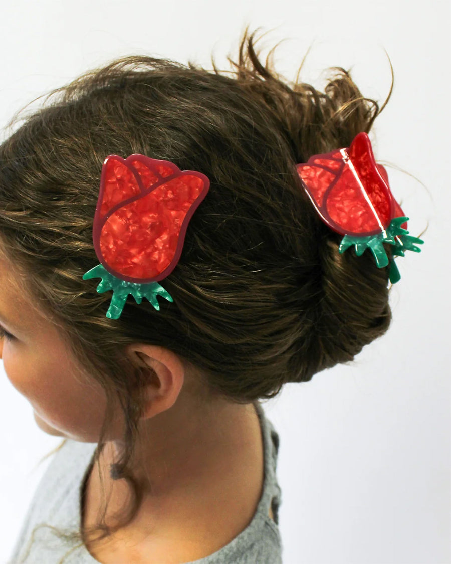 model wearing red rose hair claw