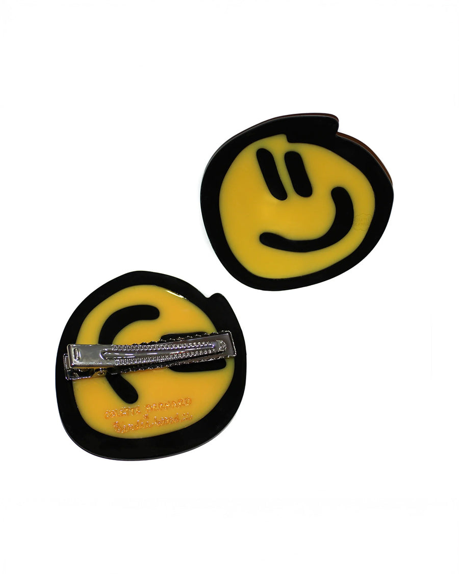front and back view of birdie wood collab yellow smiley hair clip