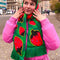 model wearing green plaid scarf with all over strawberry print