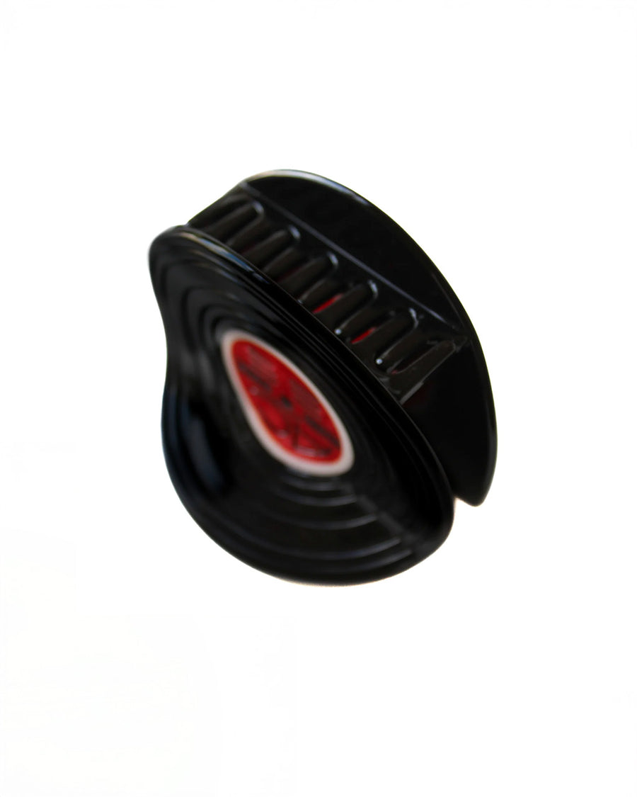 acrylic teeth on vinyl record hair claw with red center