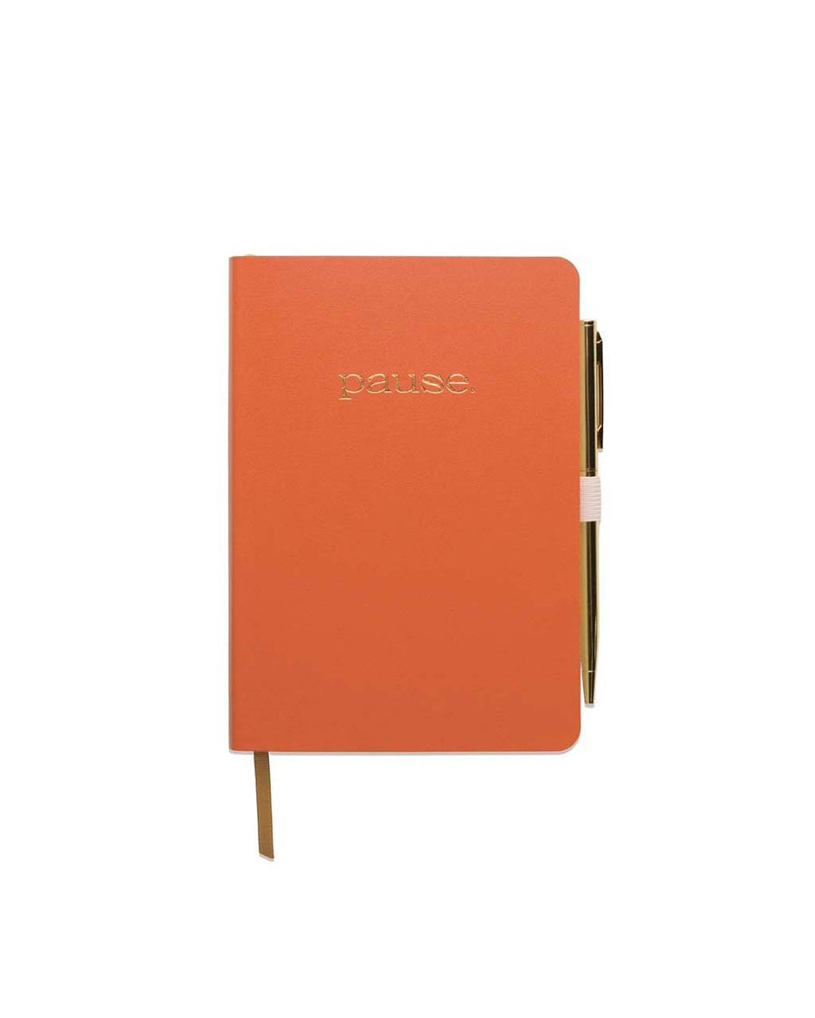 orange gratitude journal with gold foil with 'pause' and gold pen