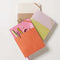 pink and orange vegan leather journal with pocket