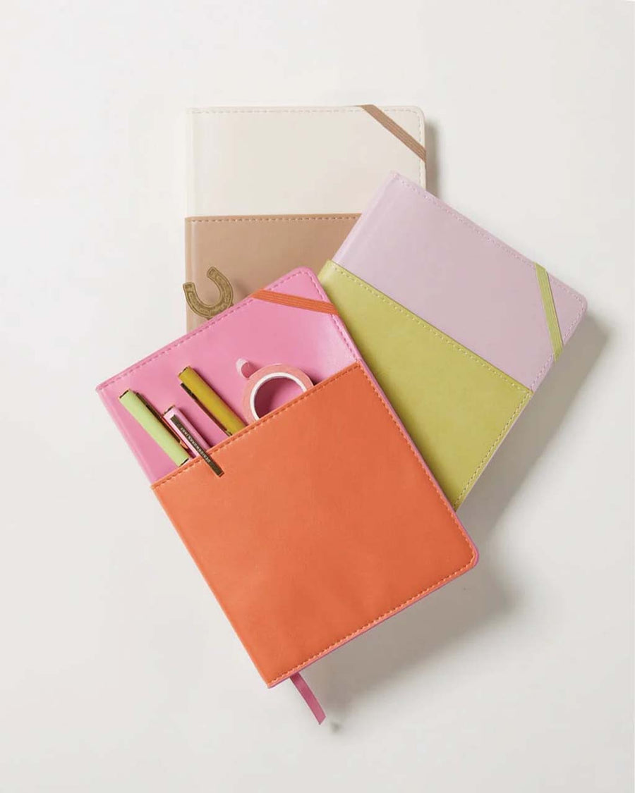 pink and orange vegan leather journal with pocket