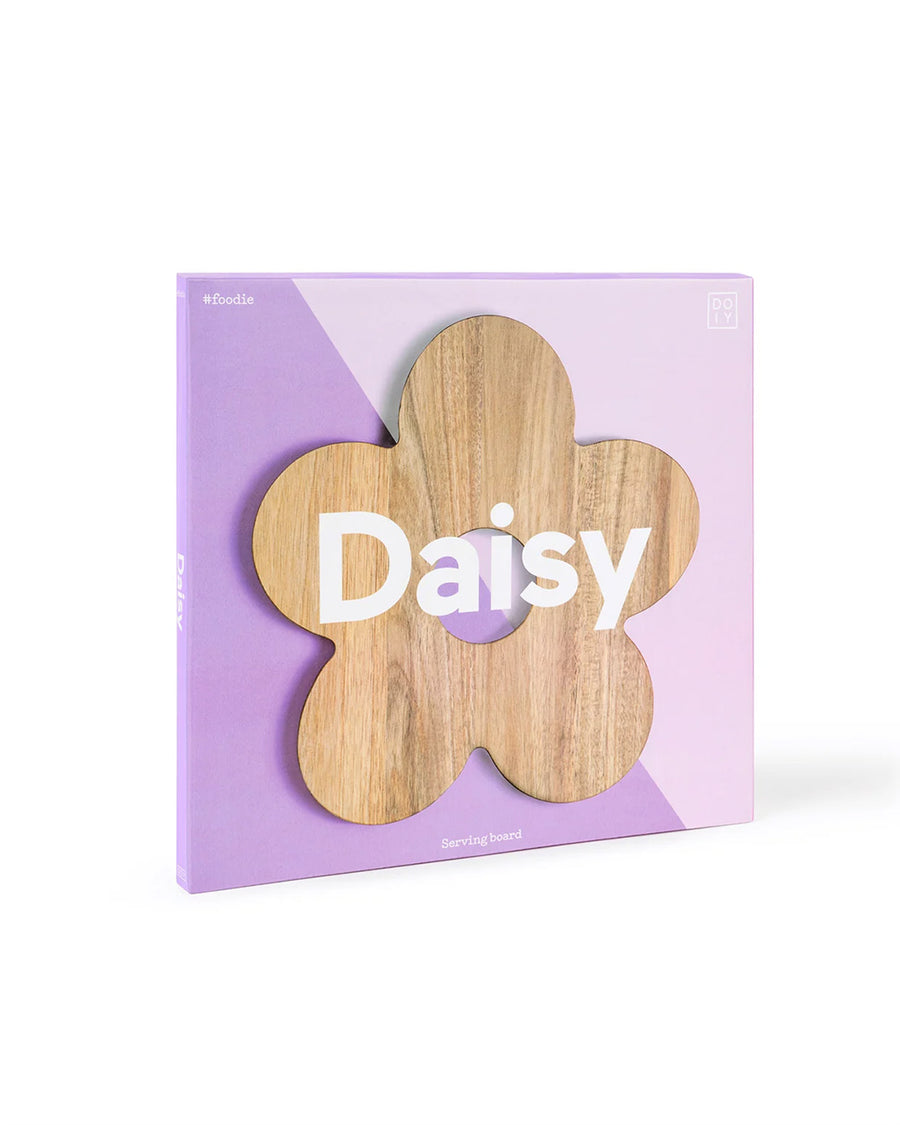 packaged wooden daisy shaped serving board with various cheeses on it