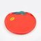 tomato shaped plate with yellow 'ripe' sticker on the left side