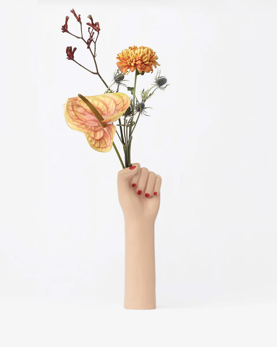 hand vase with flowers sticking out of the hands