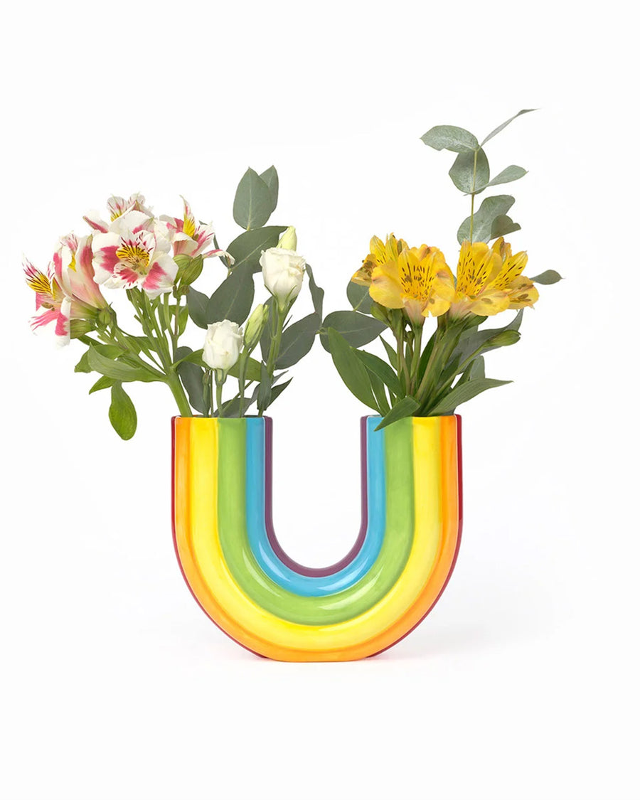 rainbow shaped vase with flowers in each end