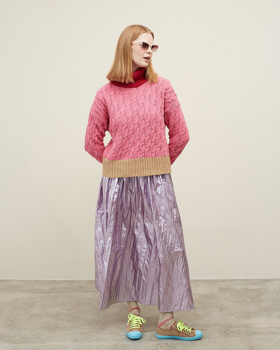 model wearing pink midi skirt with vertical stripe detail