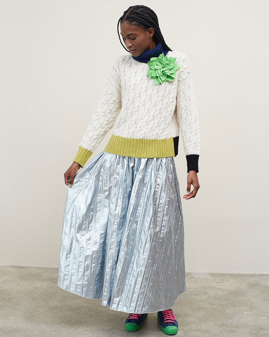 model wearing silver midi skirt with vertical stripe detail