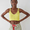 model wearing yellow knit cropped tank