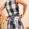 up close of model wearing indigo and white plaid midi dress with wrap waist and thick tank straps