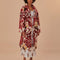 model wearing fleece midi length coat with red and gold abstract floral print